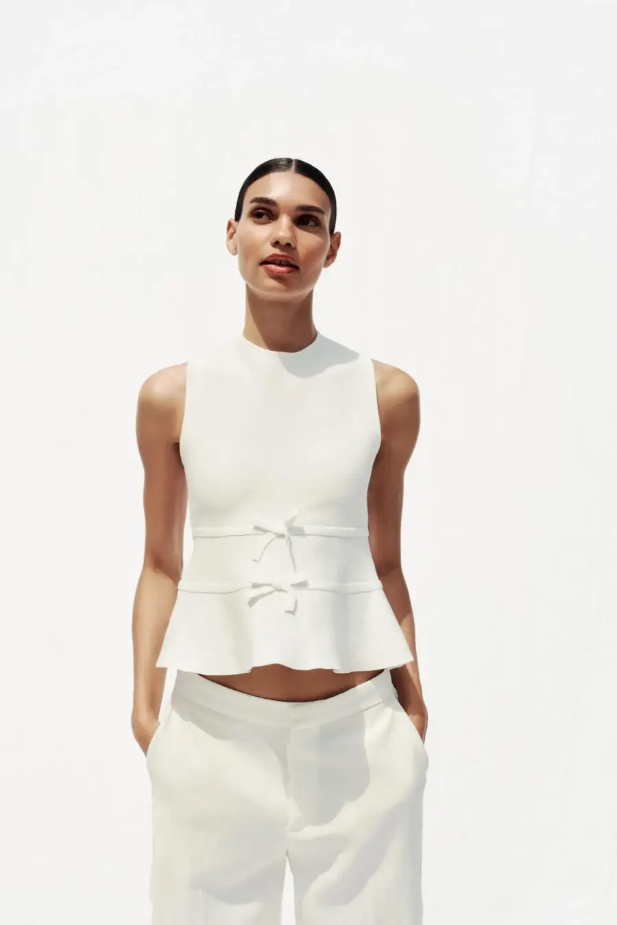 KNIT PEPLUM TOP WITH TIES