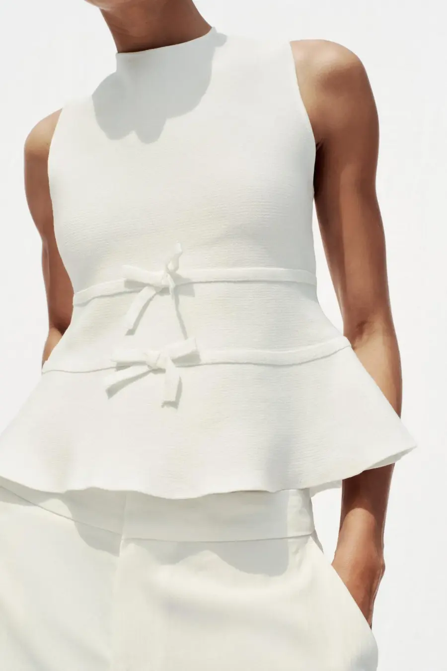 KNIT PEPLUM TOP WITH TIES
