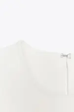 KNIT PEPLUM TOP WITH TIES
