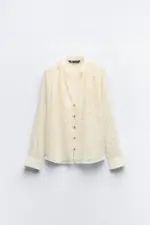 BLouse with embroidery, pleats, and shiny details