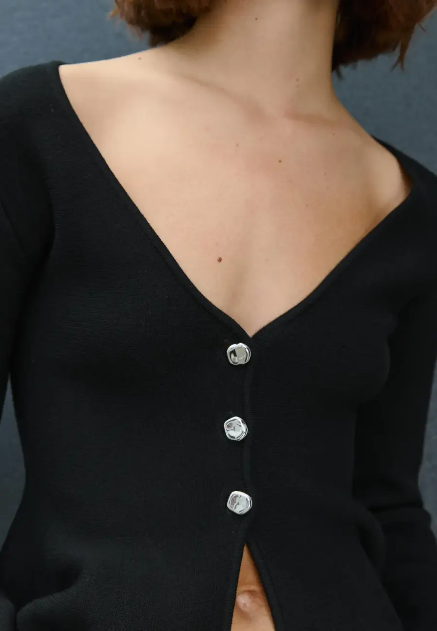 Buttoned peplum knit cardigan
